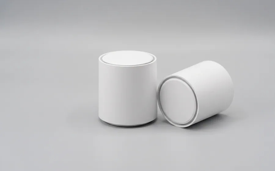 Two short white cylindrical mesh nodes, one standing and one on its side
