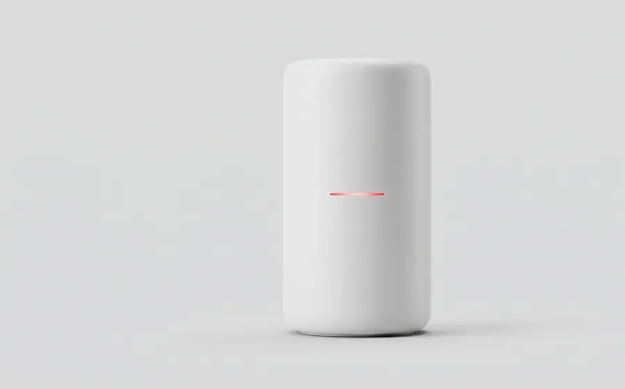 A tall white cylindrical router with a thin red status light